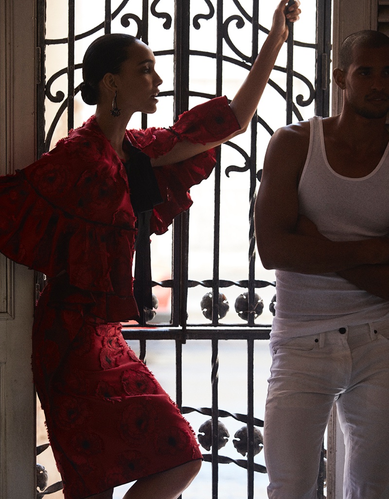 Cora Emmanuel looks red-hot in Oscar de la Renta red cape and skirt