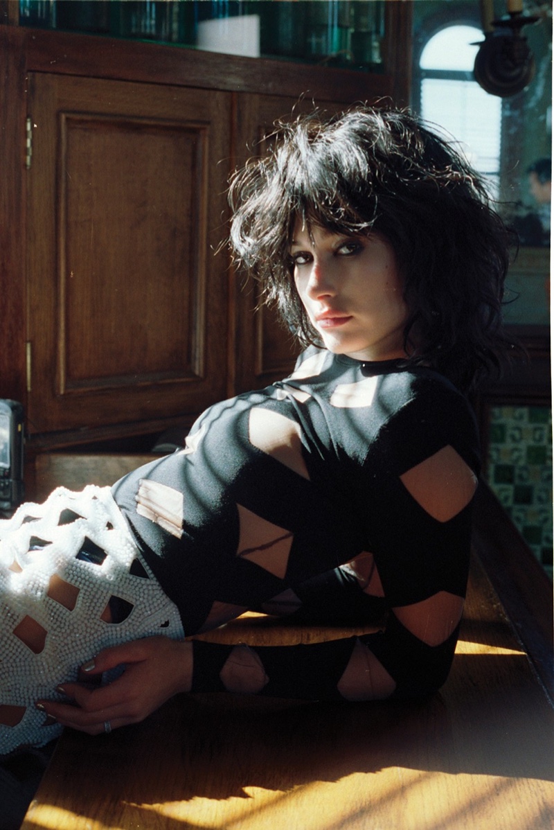 Hailey Baldwin wears a brunette wig in the fashion editorial