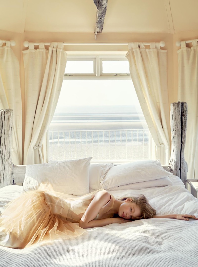Posing on a bed, Hollie-May Saker wears Stella McCartney top and trousers