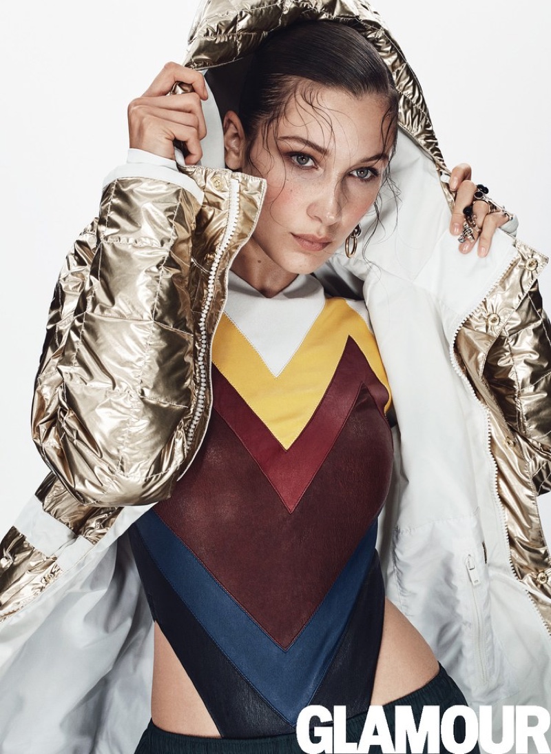 Bella Hadid wears L.A.M.B. x Burton jacket, Y/Project bodysuit, Holloway Sportswear pants, Alexander Wang earring and Dior rings