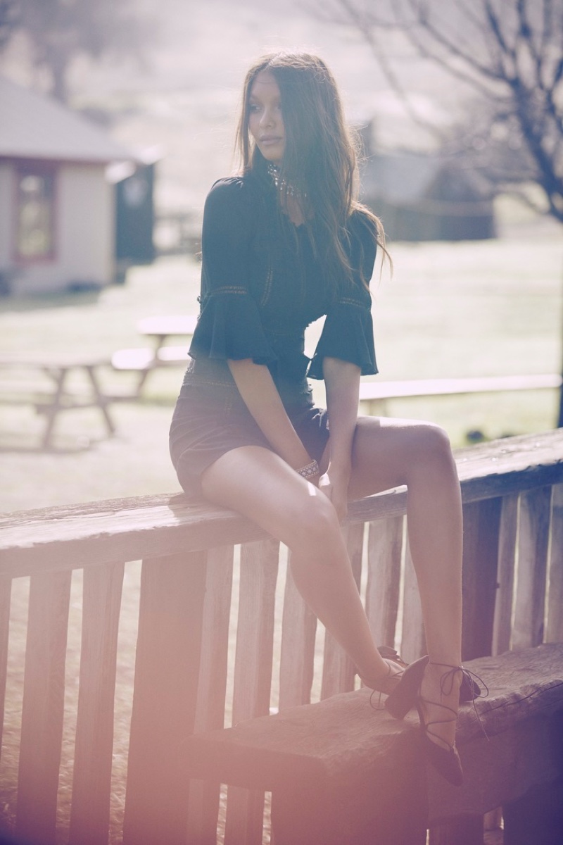 Lais Ribeiro poses in little black dress from For Love & Lemons' fall collection