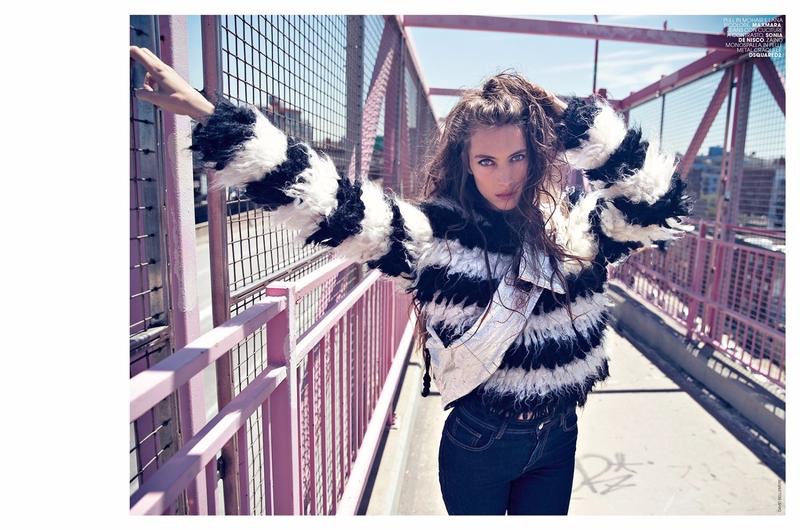 The model wears a mohair and wool sweater by Max Mara with jeans by Sonia de Nisco