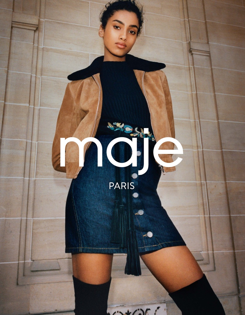 Maje's fall 2016 campaign features model Imaan Hammam wearing cropped jacket, black shirt and denim mid-length skirt