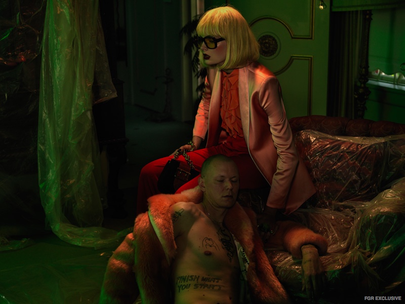 (On Her) Pink Blazer Daniel Avakian, Pink Shirt Kate Sylvester, Red Pants Kate Sylvester, Belt The Sleeveless Society, Sunglasses Gucci, Rings Dinosaur Designs (On Him) Jacket Wheels and Dollbaby 