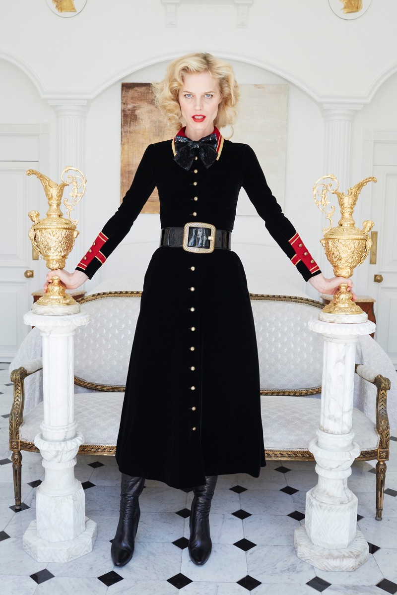 Eva Herzigová stands at attention in a military-inspired long dress from Saint Laurent for Barneys New York's fall-winter 2016 campaign.