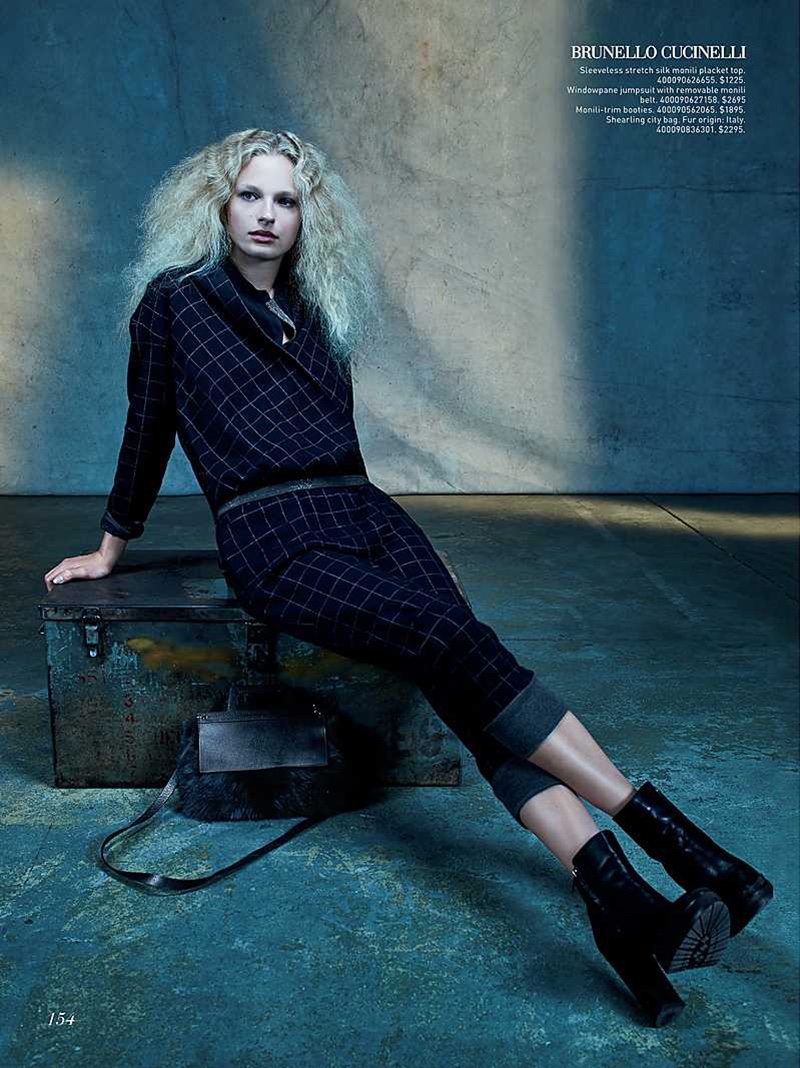 The model poses in dark, 90's inspired looks for the fashion editorial