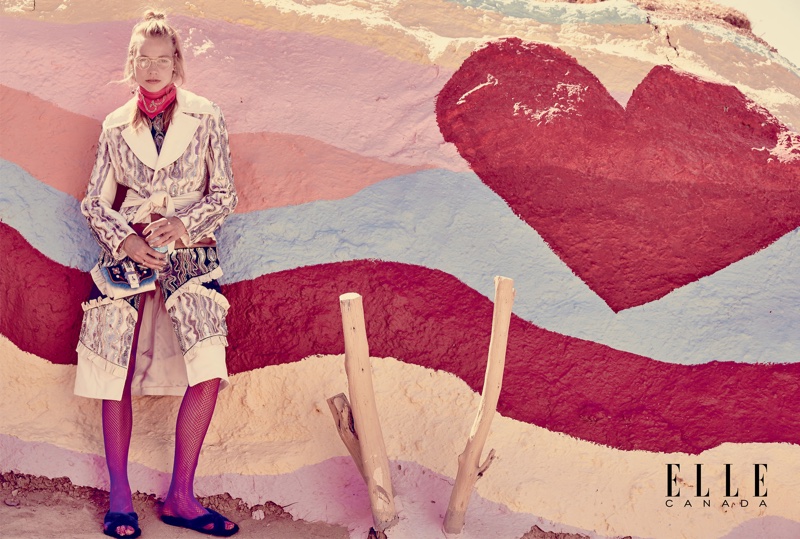 The model poses in whimsical fall fashions for the editorial