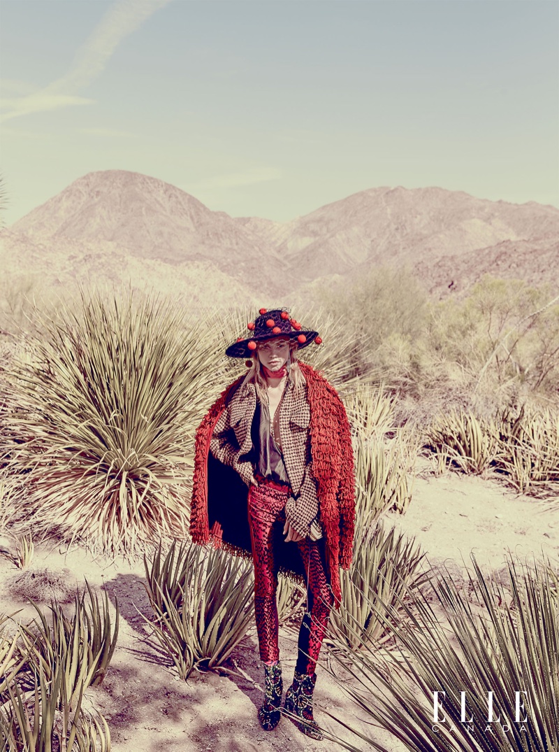 Laura Schellenberg poses in western inspired look with Philip Treacy hat