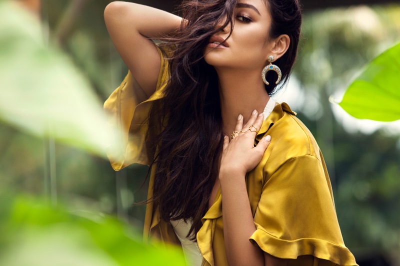 Shay Mitchell wears BaubleBar Zosma Drop Earrings and Intergalactic Ring Quartet Set