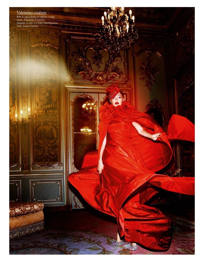 Looking seductive in red, Gigi Hadid models Valentino Haute Couture gown and cape