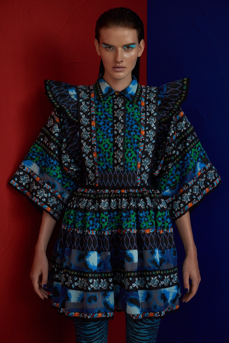 Wearing a look from the Kenzo x H&M collaboration, Dorota Kullova embraces colorful prints