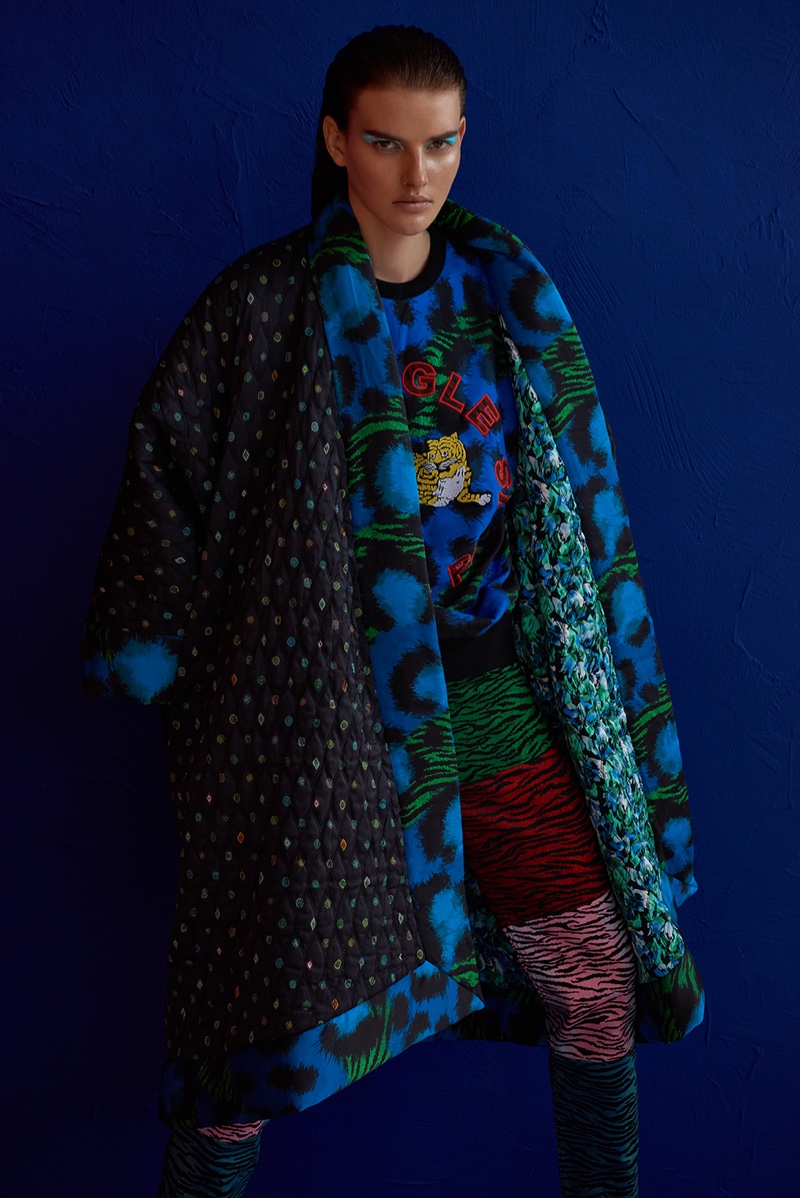 Model Dorota Kullova wears a sweater, coat and skirt from the Kenzo x H&M collaboration