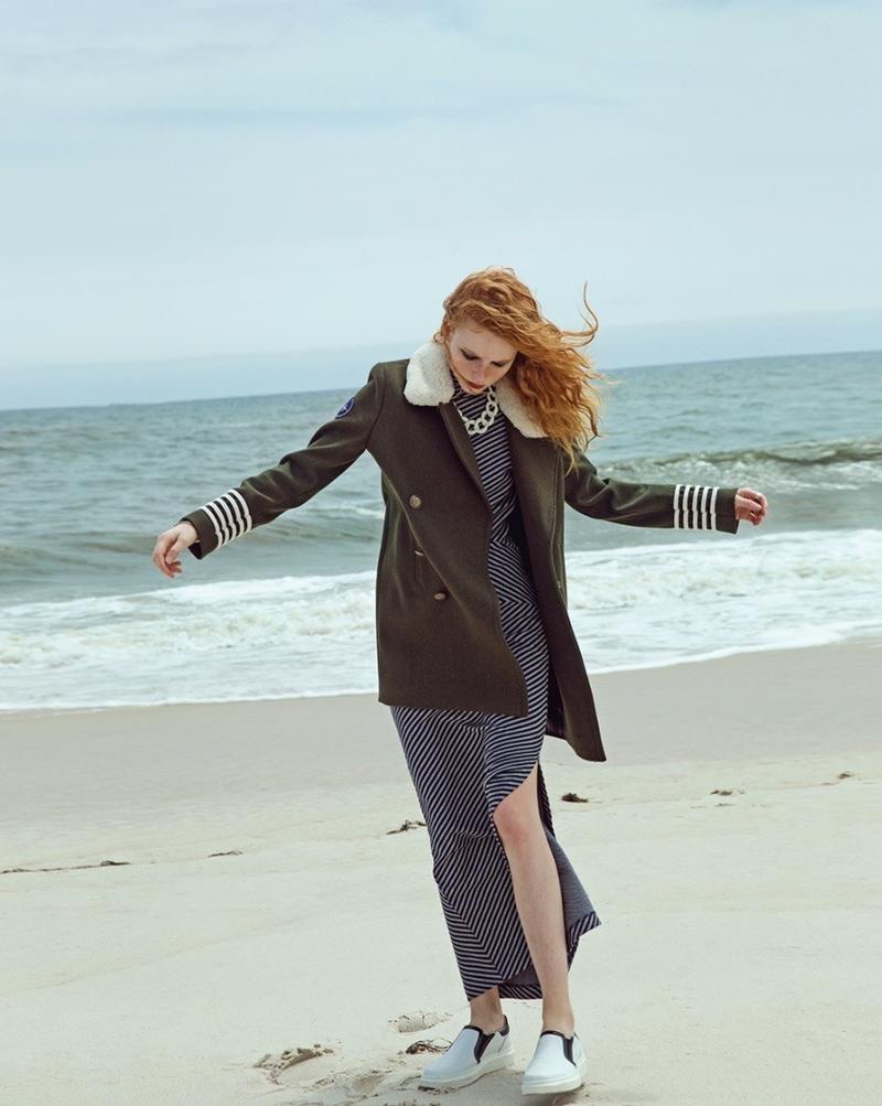 Embracing the breeze, Madison wears military peacoat, striped dress and white slip-on sneakers from Gigi Hadid x Tommy Hilfiger