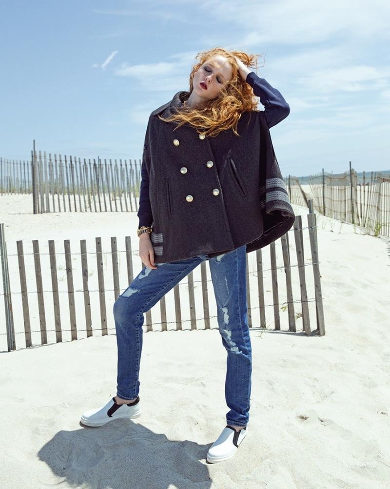 Madison Stubbington models Gigi Hadid x Tommy Hilfiger cape and jeans