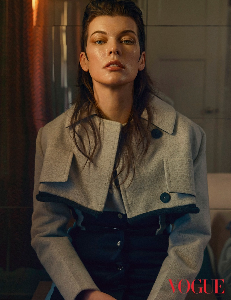 Milla Jovovich poses in Louis Vuitton coat