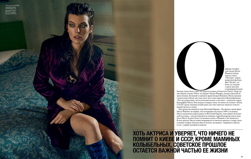 Milla Jovovich poses in Dior coat and Kenzo boots