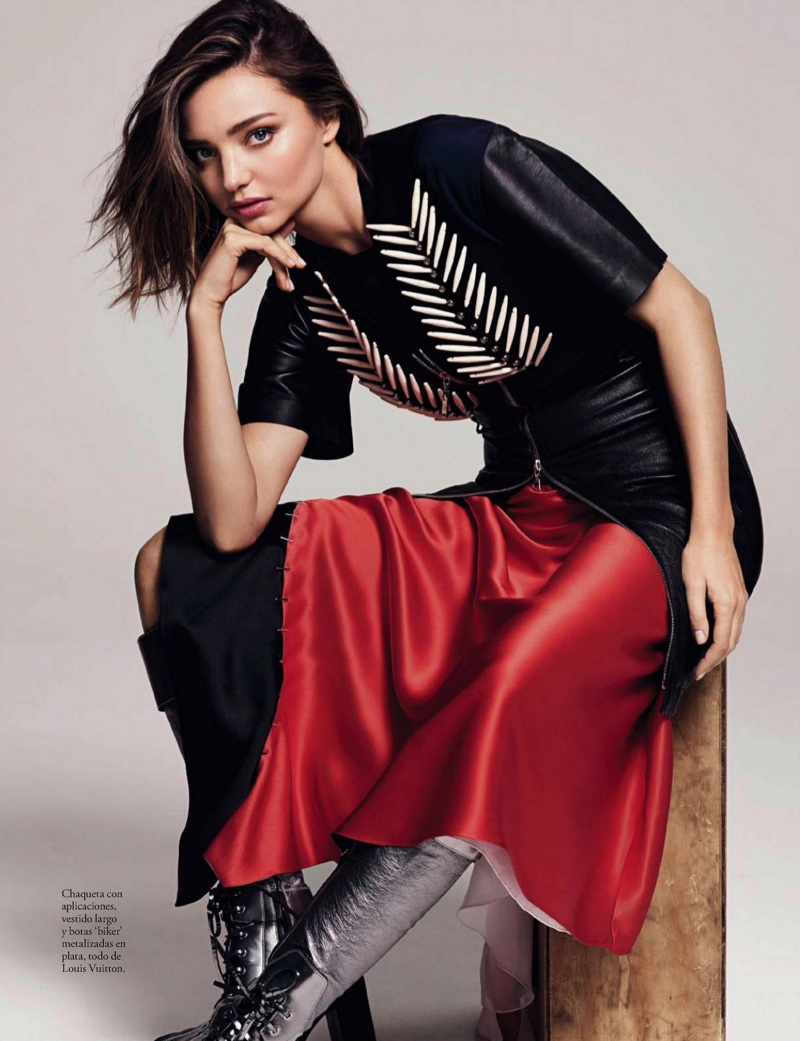 Striking a pose, Miranda Kerr wears appliquéd jacket, silk dress and biker boots from Louis Vuitton
