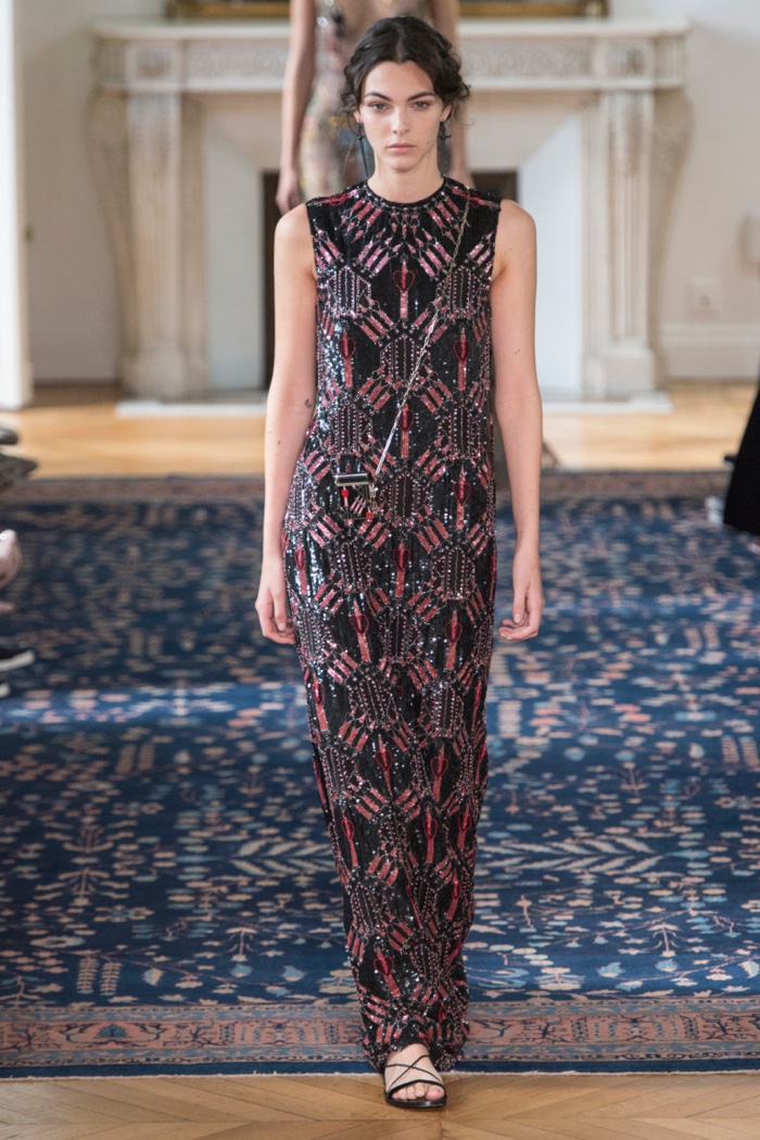 Valentino Spring 2017: Model walks the runway in black gown with pink and red embroidery 