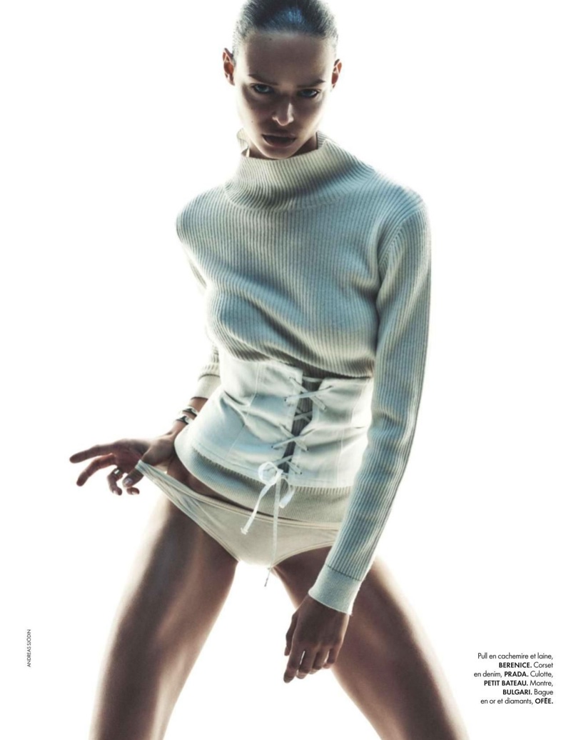 Birgit Kos wears Berenice cashmere and wool sweater, Prada corset and Petit Bateau underwear