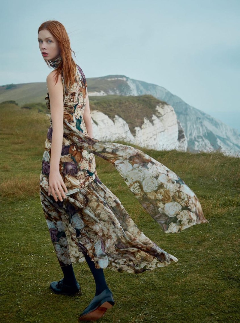 Looking at the camera, Dani Witt wears Christopher Kane dress