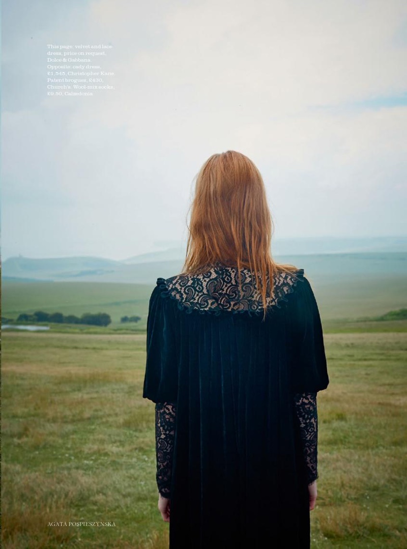 Showing her back, the model wears Dolce & Gabbana lace and velvet dress