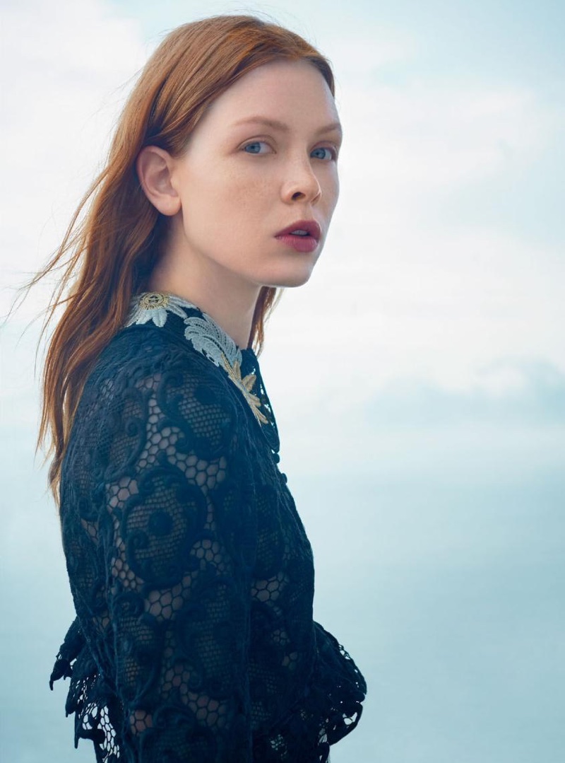 The model wears a guipure dress from Erdem