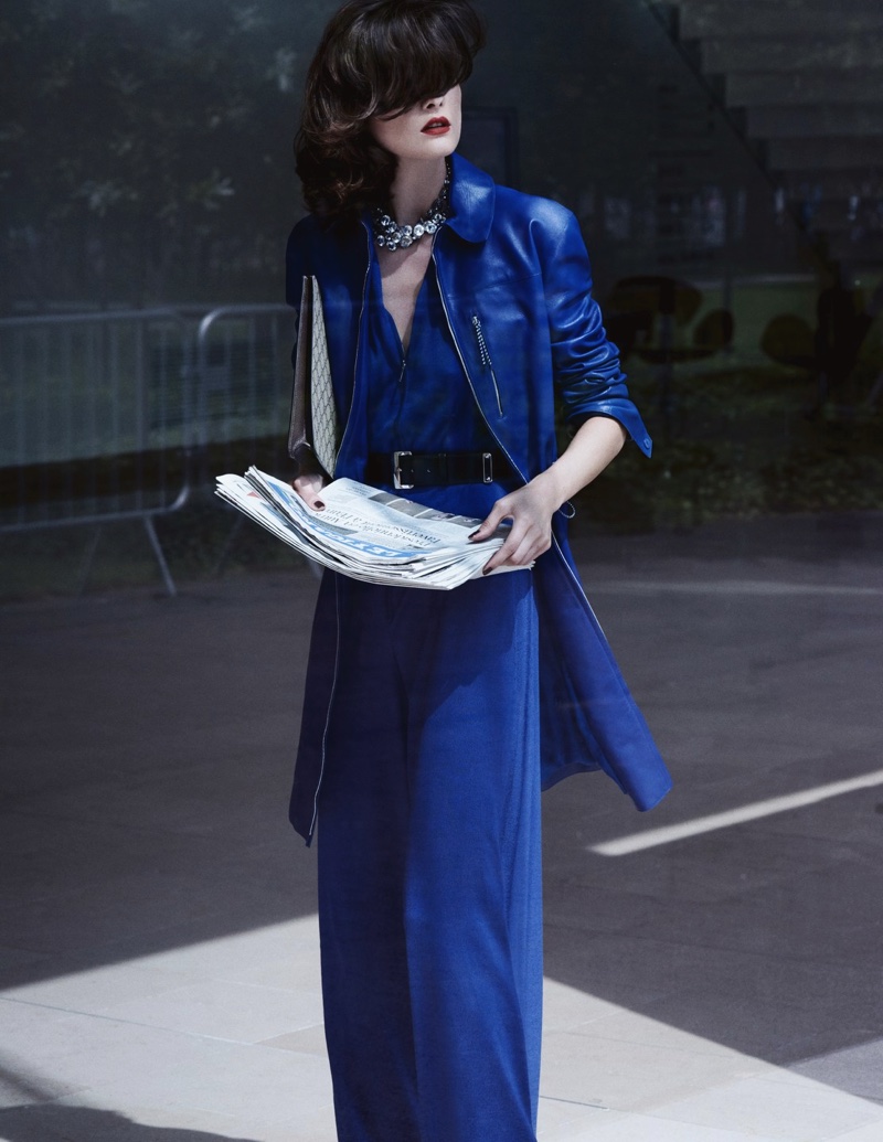 The model poses in office-ready outfits for the fashion editorial