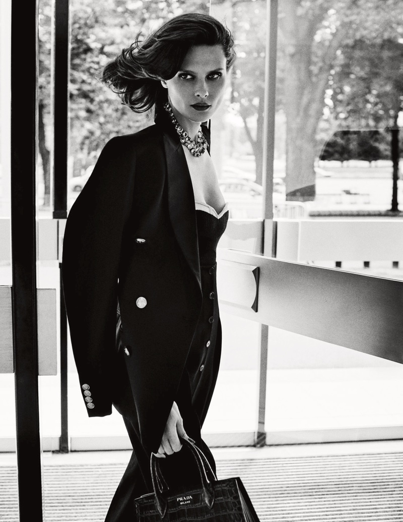 Elena Melnik serves fame fatale in embellished jacket and strapless top