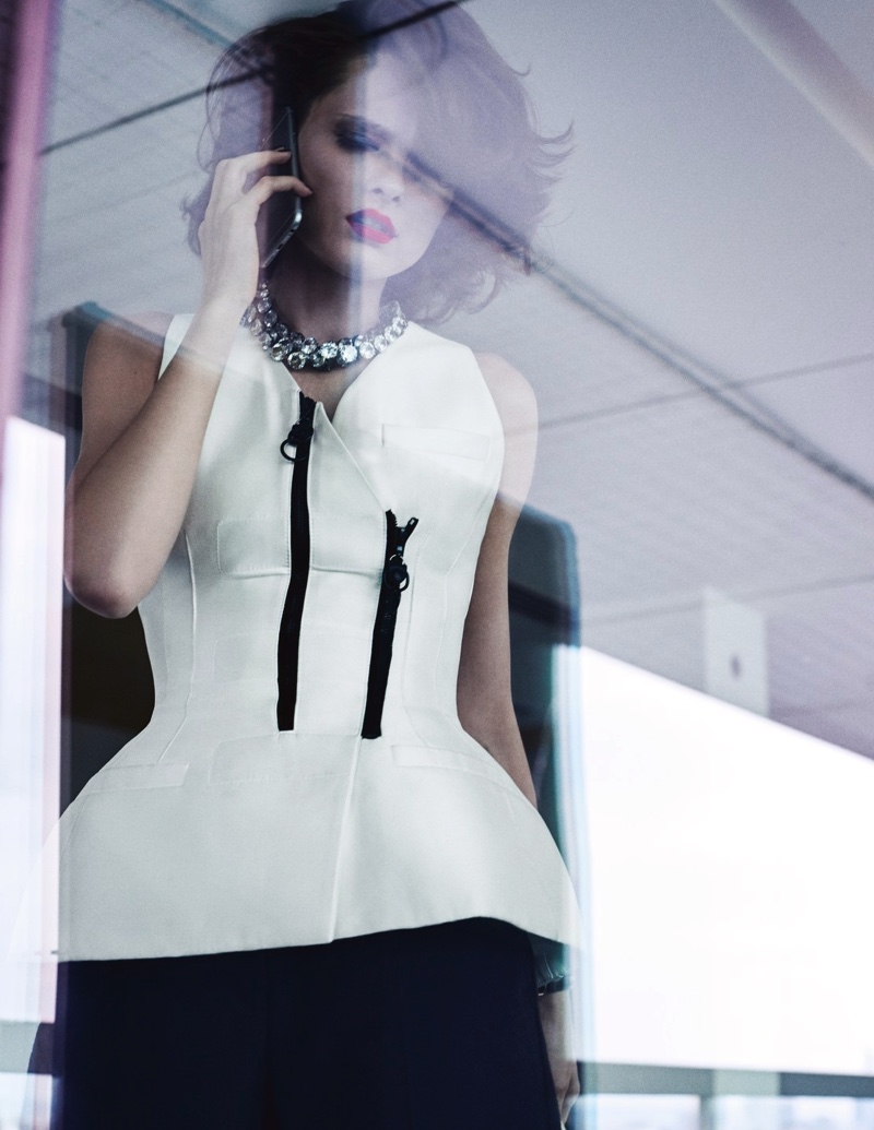 The model wears Louis Vuitton bustier top with embellishments