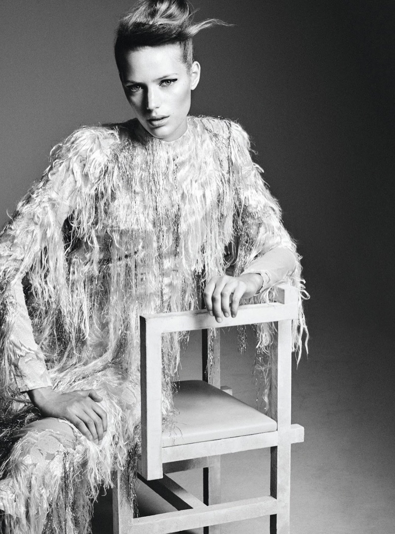The model poses in sparkling looks for the fashion editorial