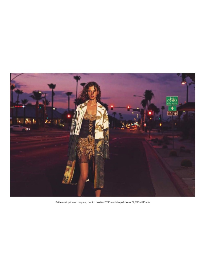 Posing on the city streets, the model wears faille coat, denim bustier and cloque dress from Prada