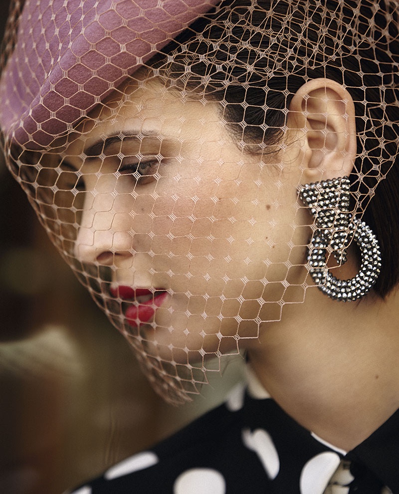 Getting her closeup, Hanaa Ben Abdesslem wears mesh mask