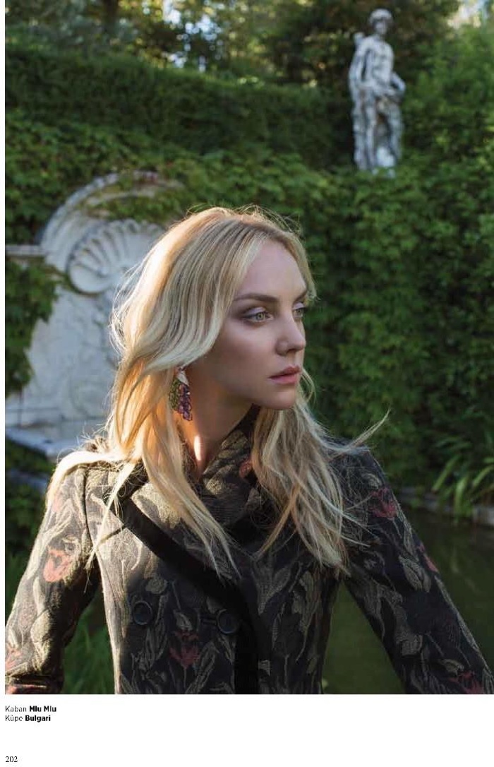 Heather Marks models Miu Miu coat with Bulgari earrings