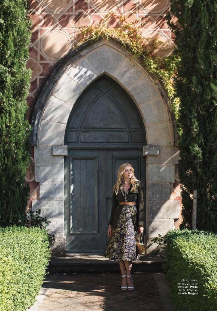 Heather Marks strikes a pose in Prada jacket, dress, shoes and bag
