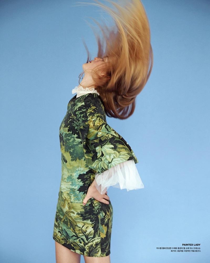 Flipping her hair, Jean Campbell wears printed dress from Burberry with ruffled sleeves