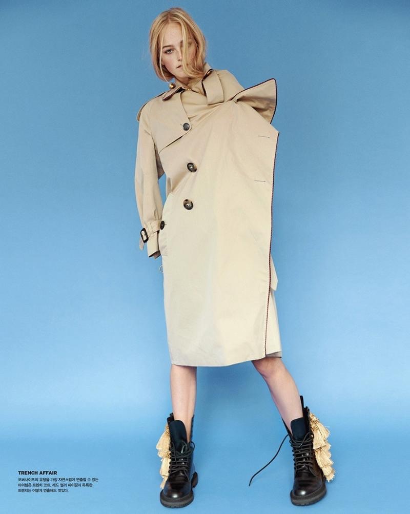 Posing in the studio, Jean Campbell wears Burberry trench coat
