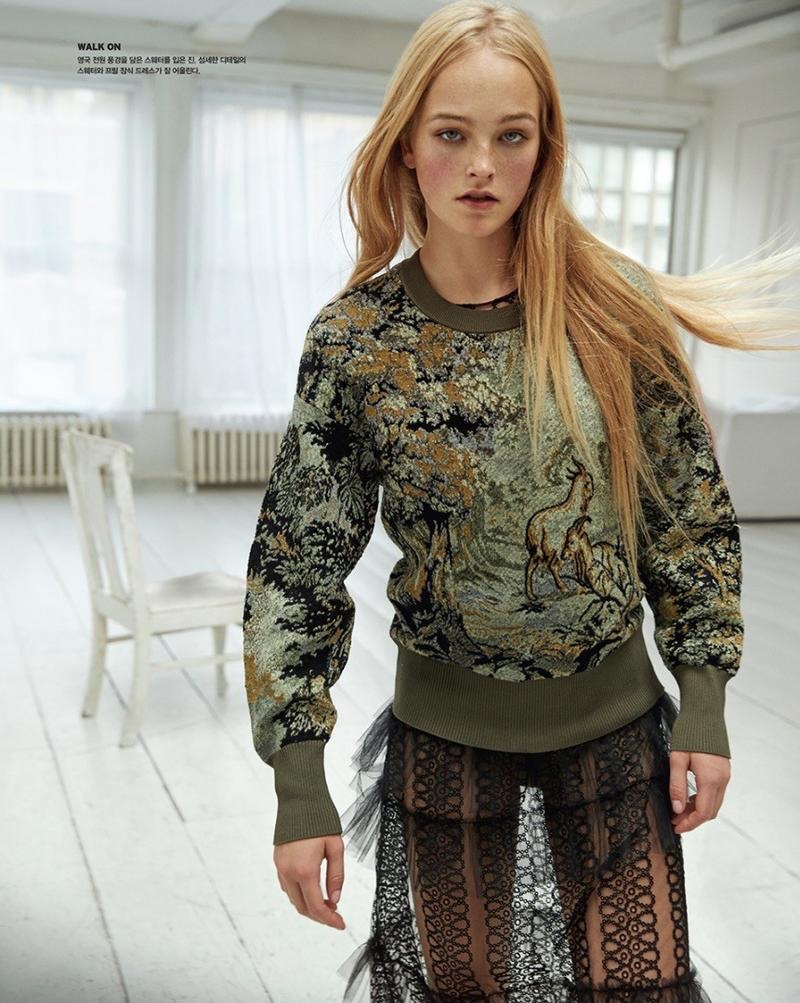 Model Jean Campbell wears Burberry embroidered sweatshirt with sheer skirt