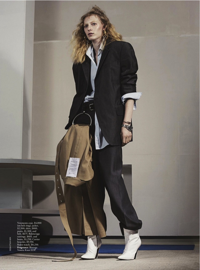 The model poses with Vetements coat, jacket, shirt and pants