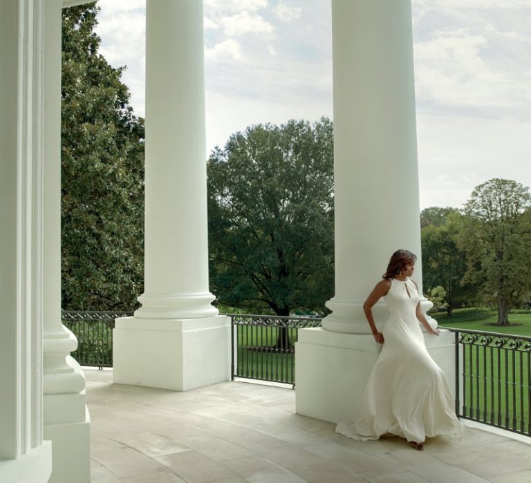 Posing in white, Michelle Obama wears Carolina Herrera dress