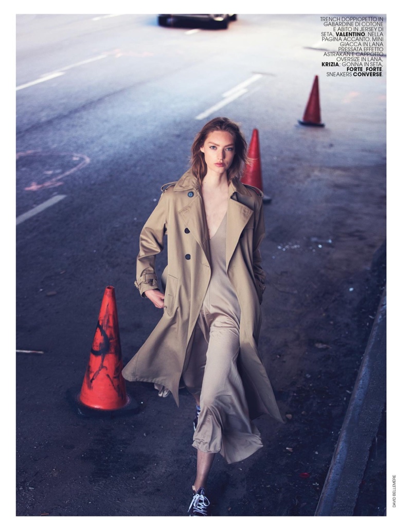The model hits the streets in trench coat and cotton dress from Valentino