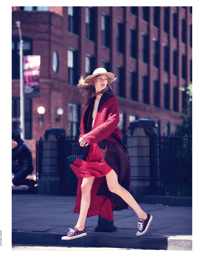 Standing out in red, Susanne Knipper wears Krizia wool jacket and oversized wool coat with Converse sneakers