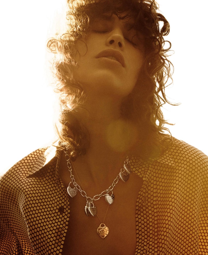 Embracing the sun, the model poses with Tiffany & Co. Return to Tiffany pendants 