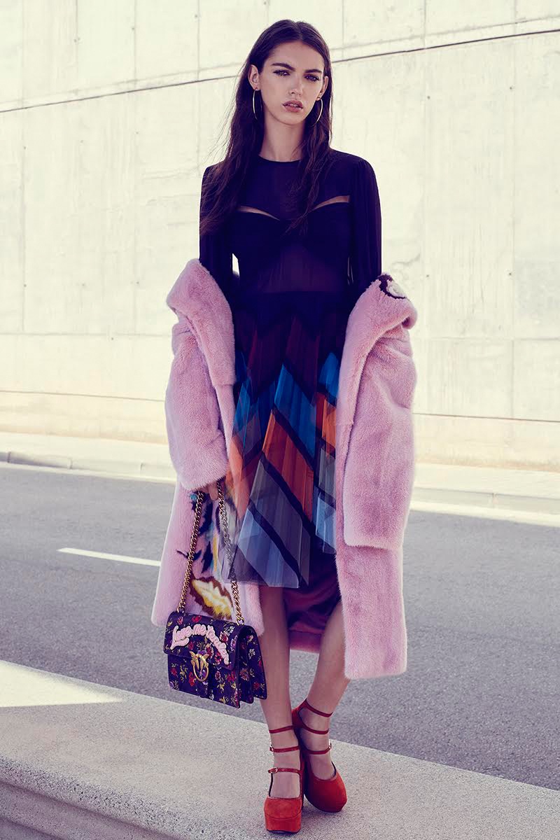 Posing roadside, Anisia Khurmatulina wears Mary Katrantzou dress, Jorge Vazquez for El Corte Ingles coat, Mango earrings, Pinko bag and Robert Clergerie shoes