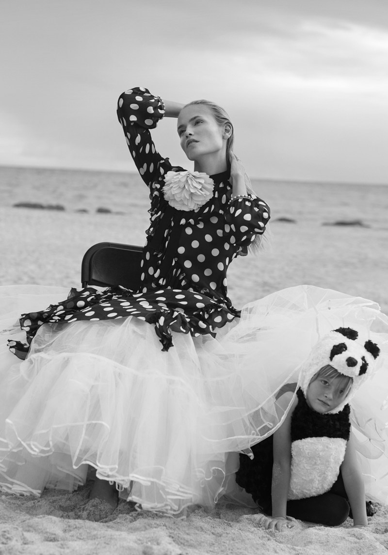 Model Natasha Poly wears Gucci silk and charmeuse dress with polka dot print and tulle skirt