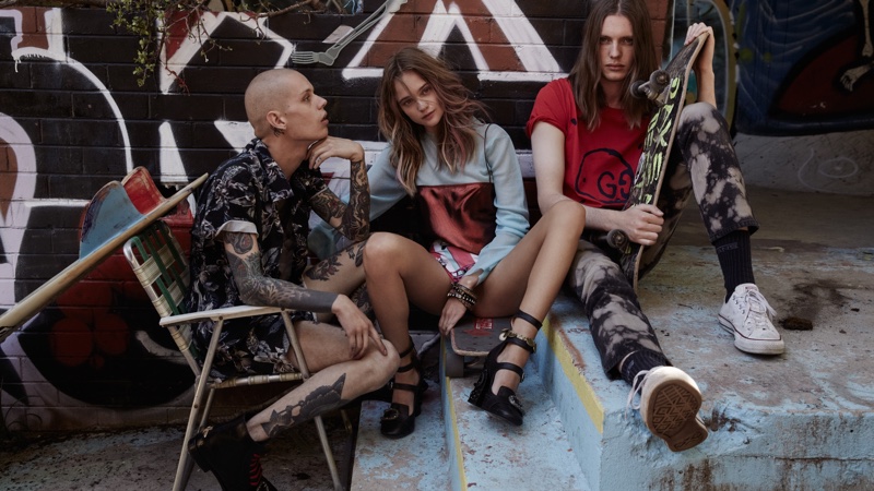 The model wears Ellery sleeveless and mesh tops with Gucci pumps