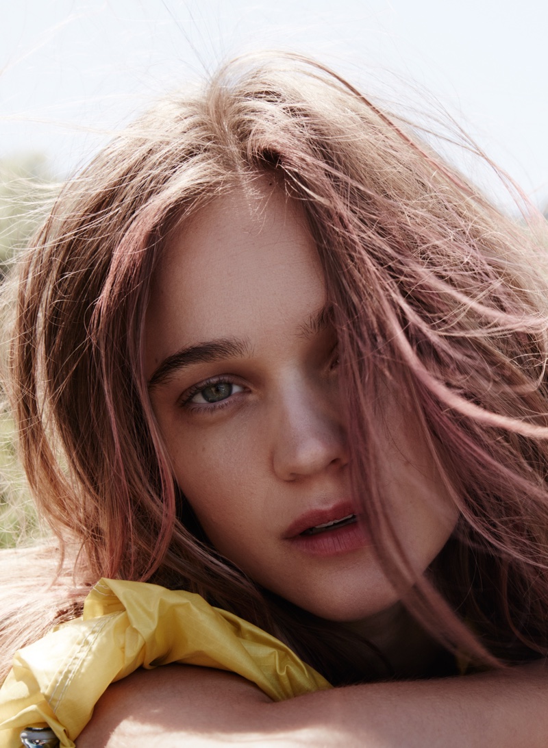 Getting her closeup, Rosie Tupper wears Prada jacket with pink streaks in her hair