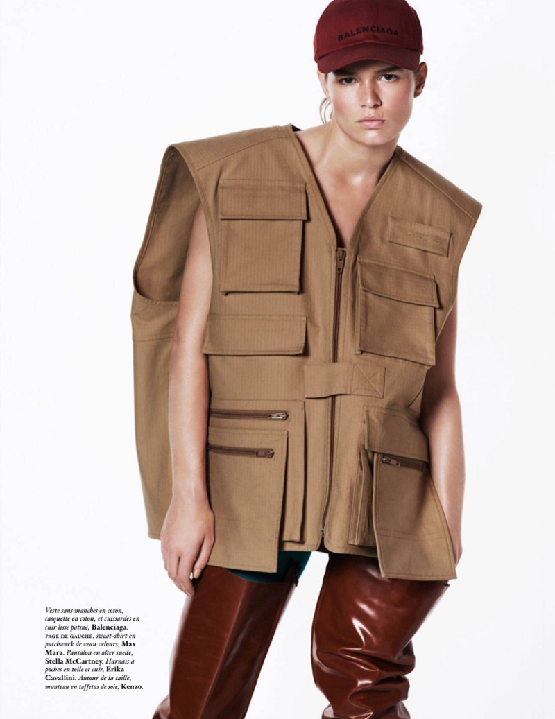 Layering up, Anna Ewers model Balenciaga vest, hat and leather leg straps