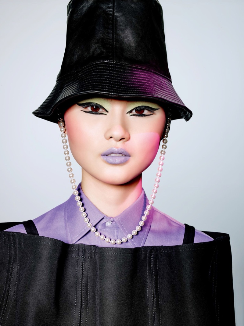 Model He Cong looks pretty in lavender with green eyeshadow
