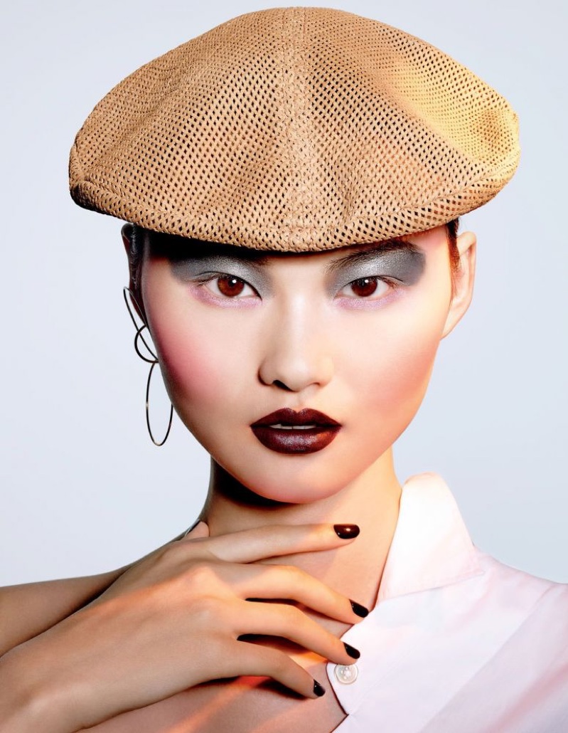 He Cong wears chocolate brown lipstick shade with matching manicure