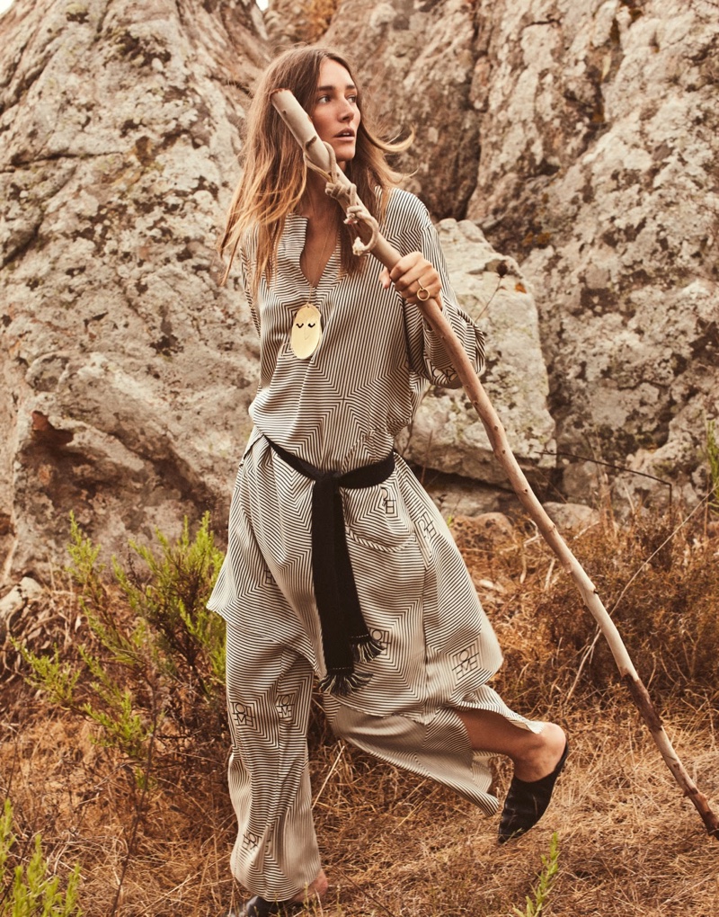 Taking a trek, Josephine le Tutour wears Totême tunic and pants with Vince shoes